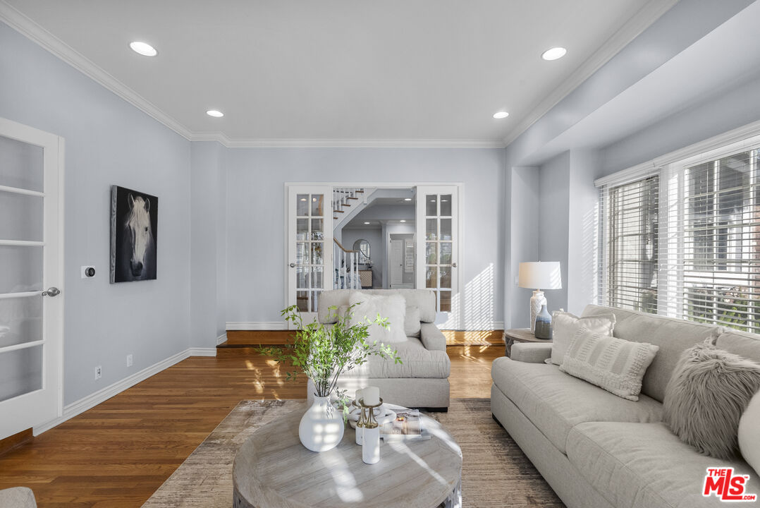 18779 Willowtree Lane Porter Ranch, CA 91326 - Photo 26 of 63 a living room with furniture and a large window