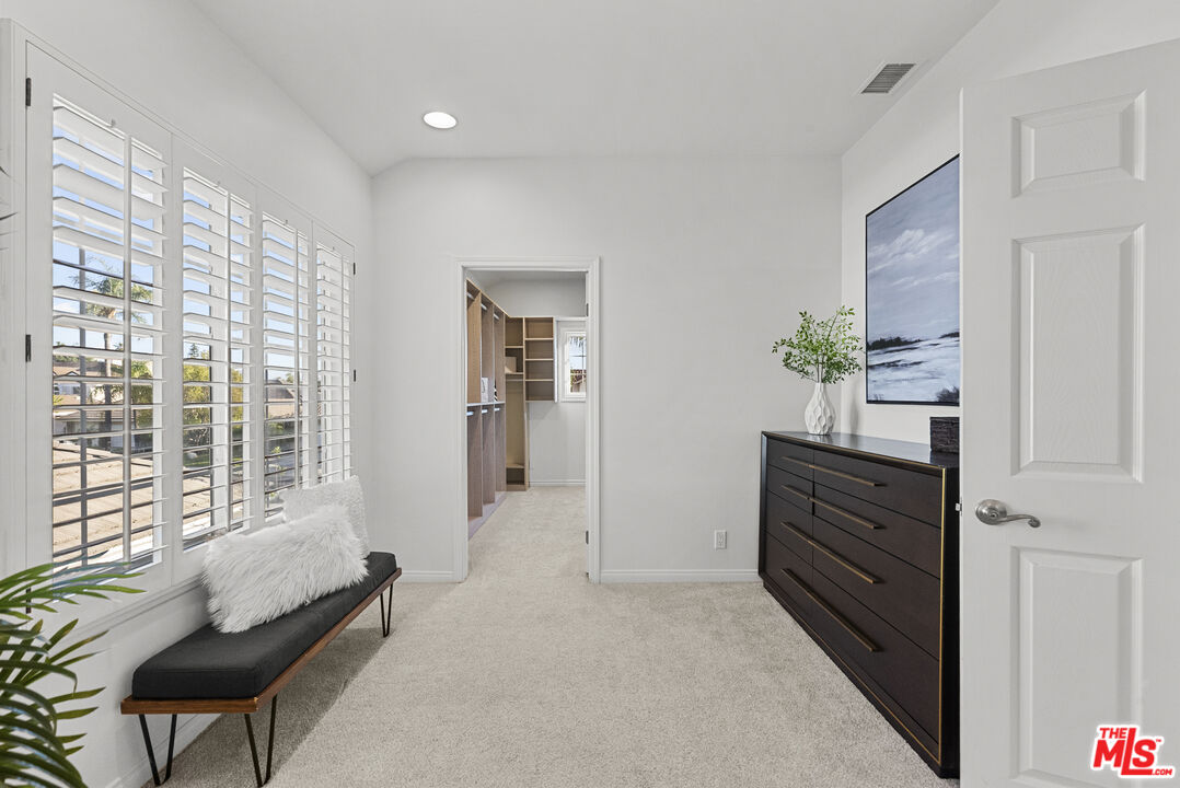 18779 Willowtree Lane Porter Ranch, CA 91326 - Photo 36 of 63 a spacious bedroom with a bed and a dresser