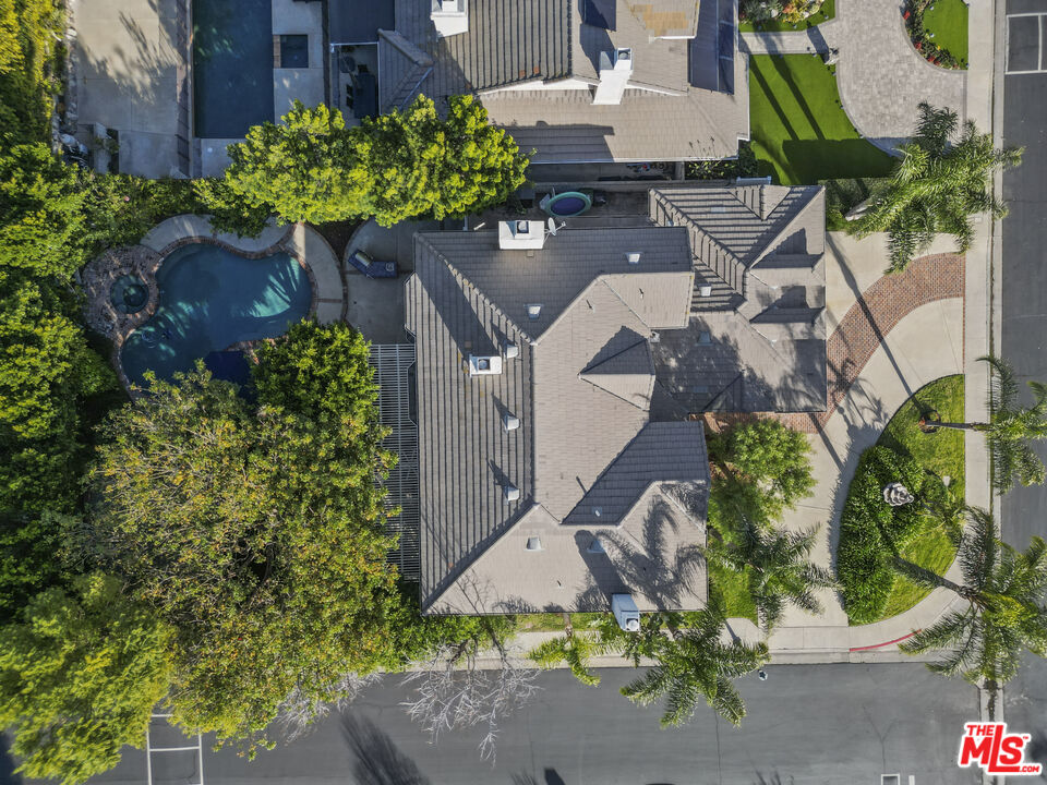 18779 Willowtree Lane Porter Ranch, CA 91326 - Photo 62 of 63 an aerial view of a house with a yard and garden