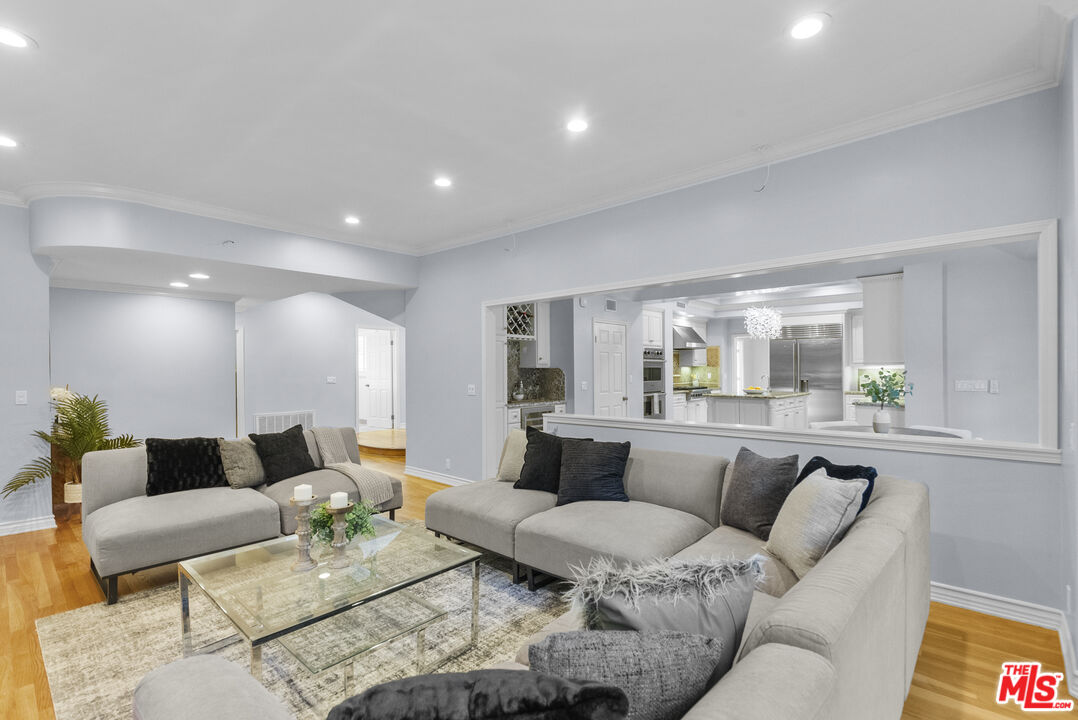 18779 Willowtree Lane Porter Ranch, CA 91326 - Photo 10 of 63 a living room with furniture and a couch