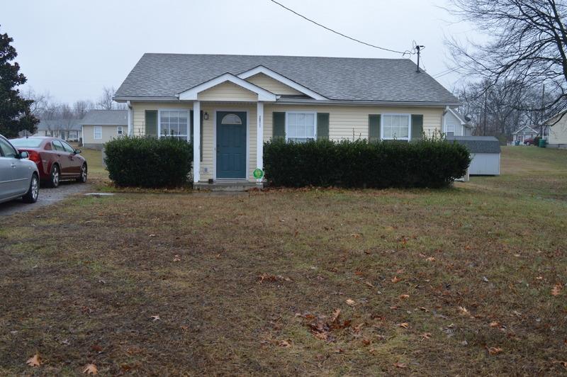 2811 Rome Lane Clarksville, TN 37040 - Photo 1 of 10 a front view of a house with a garden and yard
