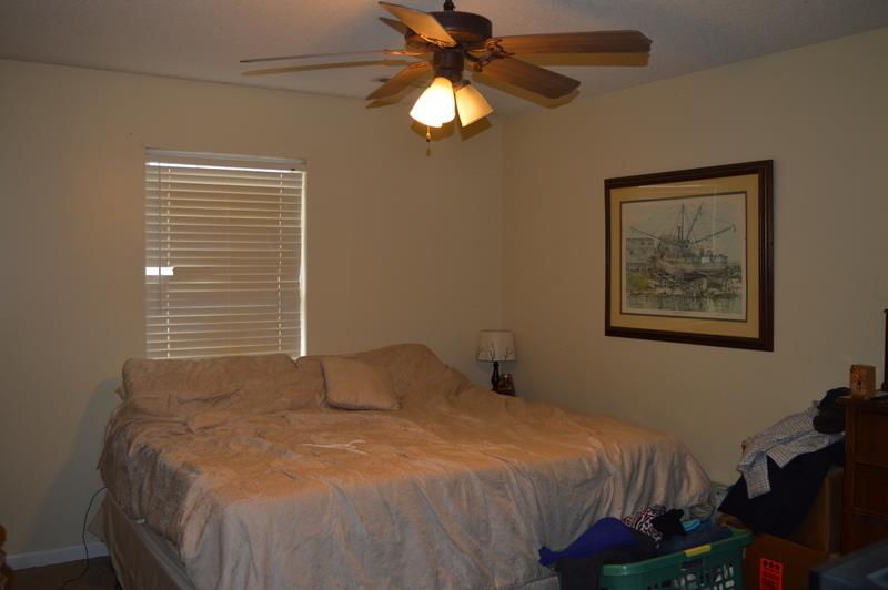 2811 Rome Lane Clarksville, TN 37040 - Photo 6 of 10 a bedroom with a bed and a chandelier