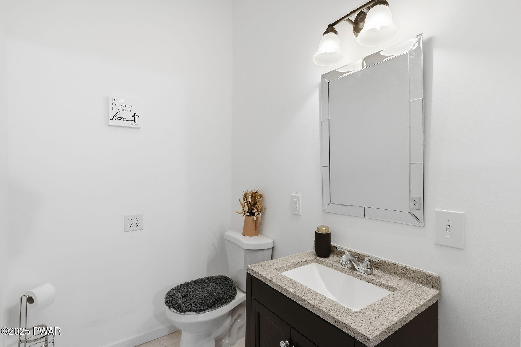 74 Charles Street Hawley, PA 18428 - Photo 13 of 40 a bathroom with a sink a toilet and mirror