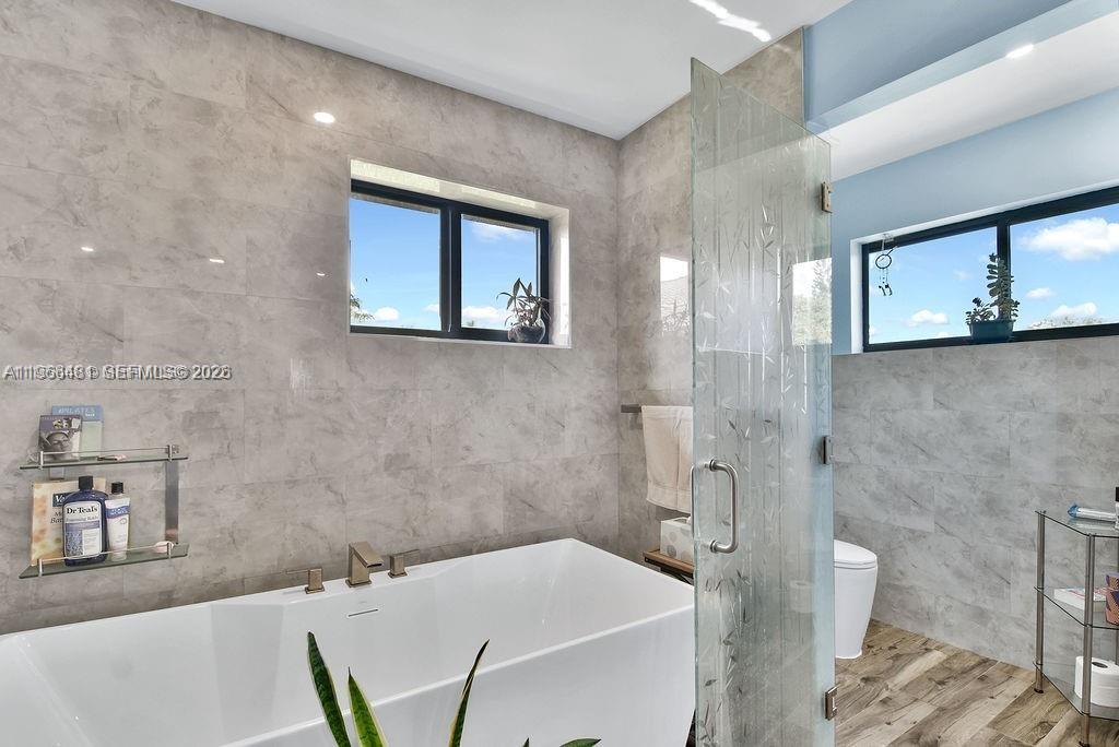 5425 Southwest 190th Avenue, Unit 1 Southwest Ranches, FL 33332 - Photo 21 of 56 a bathroom with a sink a toilet and shower