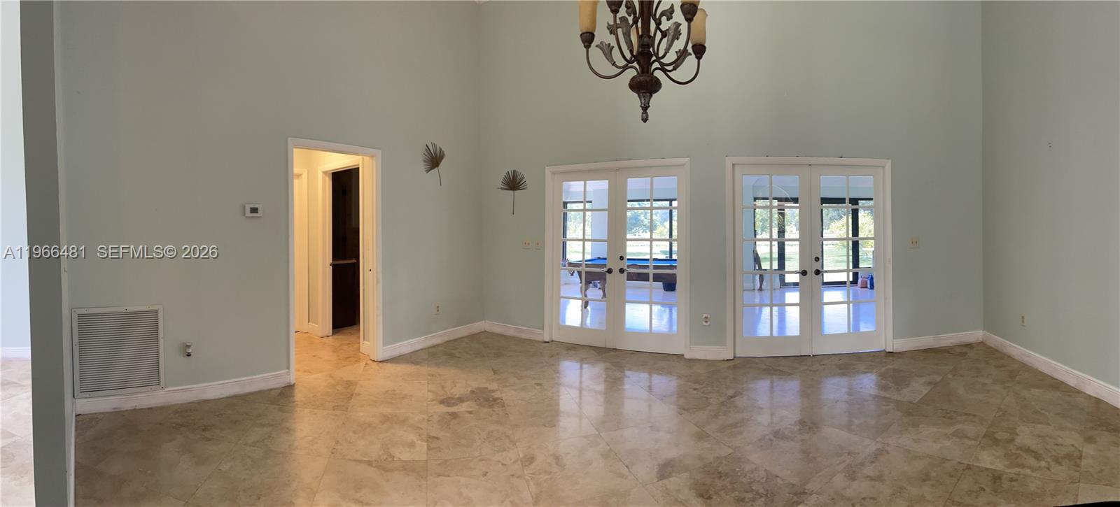 5425 Southwest 190th Avenue, Unit 1 Southwest Ranches, FL 33332 - Photo 26 of 56 an empty room with windows and painted walls