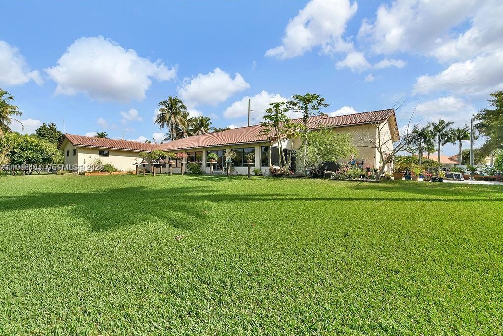 5425 Southwest 190th Avenue, Unit 1 Southwest Ranches, FL 33332 - Photo 3 of 56 a view of an house with backyard and a tree