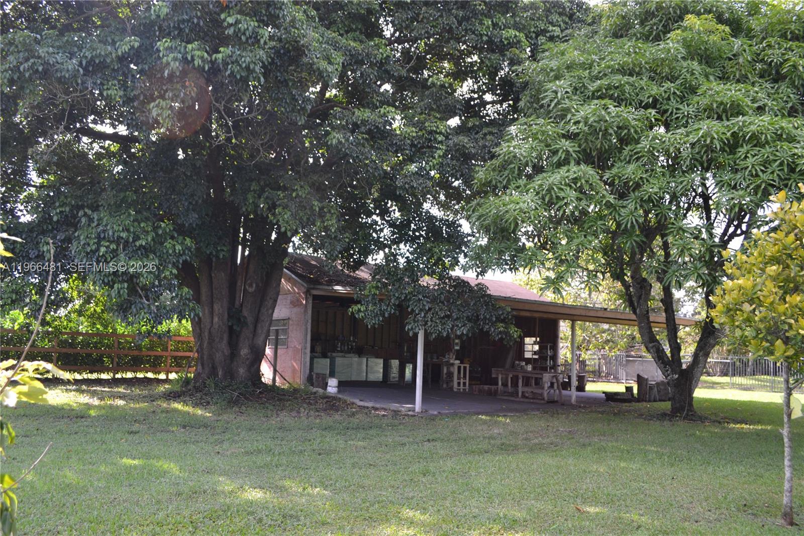 5425 Southwest 190th Avenue, Unit 1 Southwest Ranches, FL 33332 - Photo 54 of 56 a view of a tree in front of a house