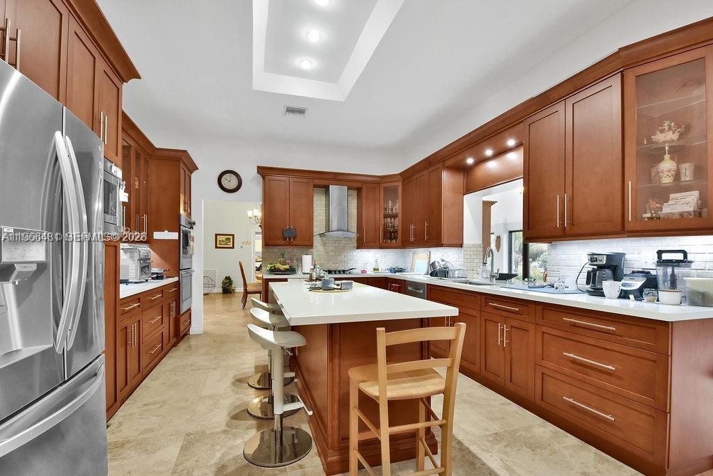 5425 Southwest 190th Avenue, Unit 1 Southwest Ranches, FL 33332 - Photo 7 of 56 a large kitchen with a table and chairs