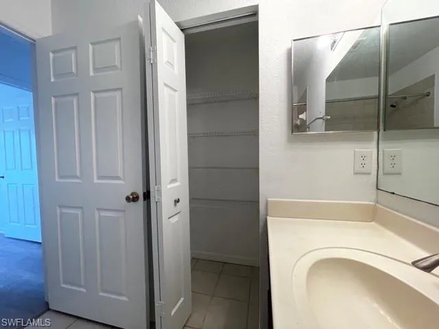 a bathroom with a tub and shower
