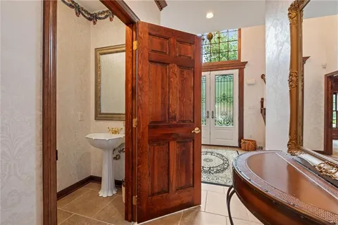 a view of a bathroom with a tub and shower