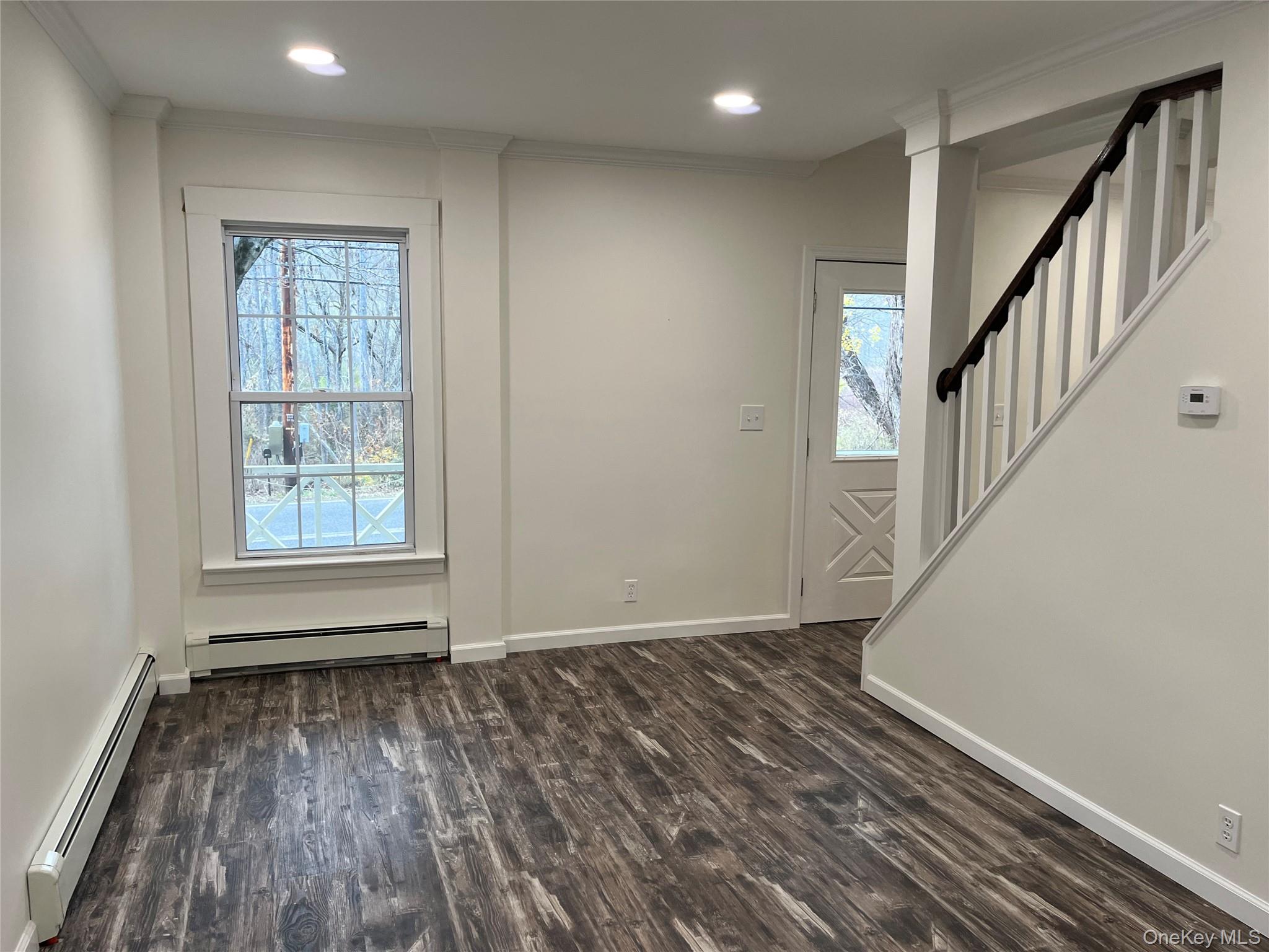 276 Old Rte 22 Wassaic, NY 12592 - Photo 14 of 23 a view of an empty room with wooden floor and a window