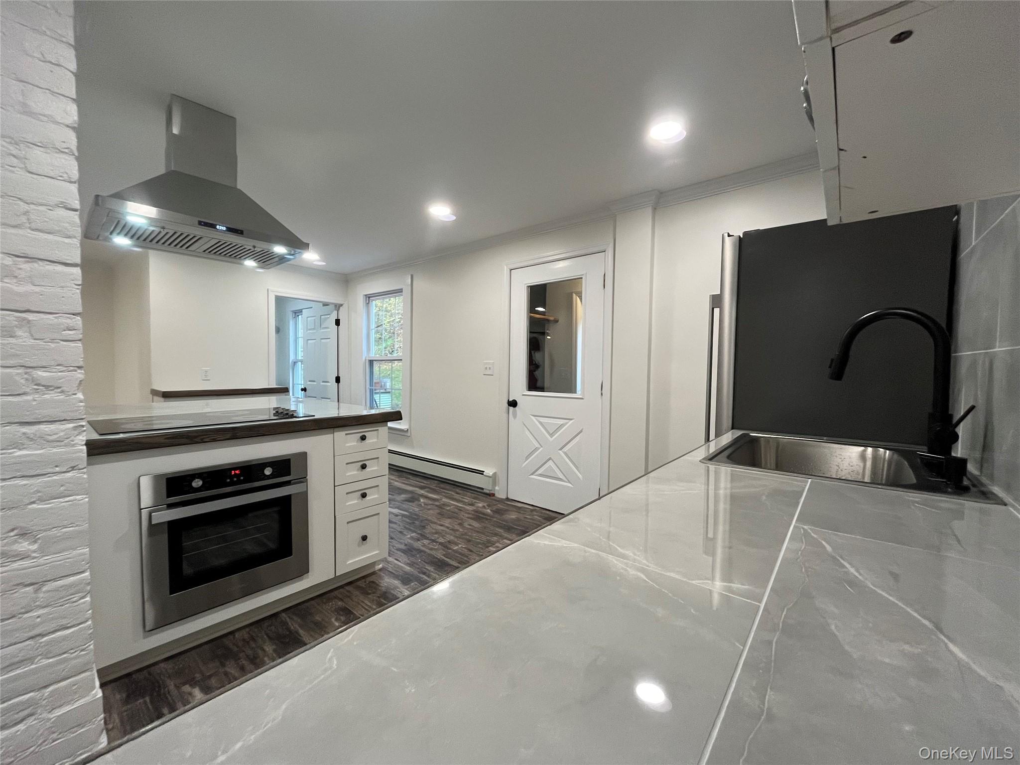 276 Old Rte 22 Wassaic, NY 12592 - Photo 17 of 23 a kitchen with stainless steel appliances granite countertop a stove a sink and a microwave