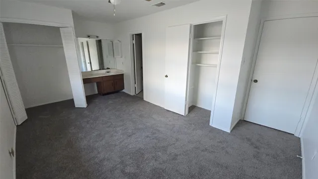 a view of room with refrigerator and cabinet