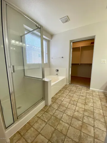 a bathroom with a sink a toilet and a shower
