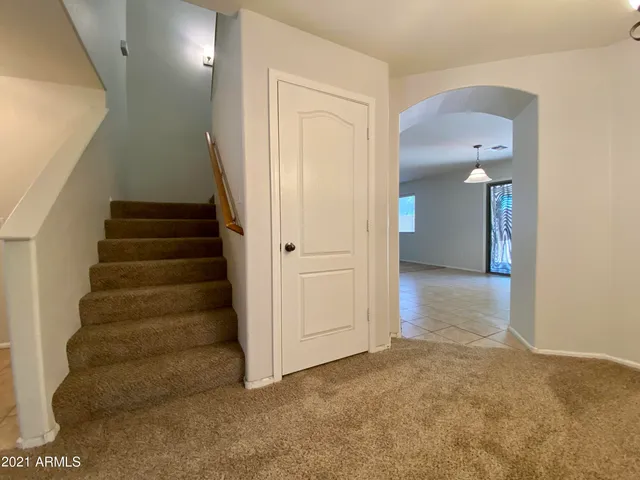 a view of a hallway with staircase