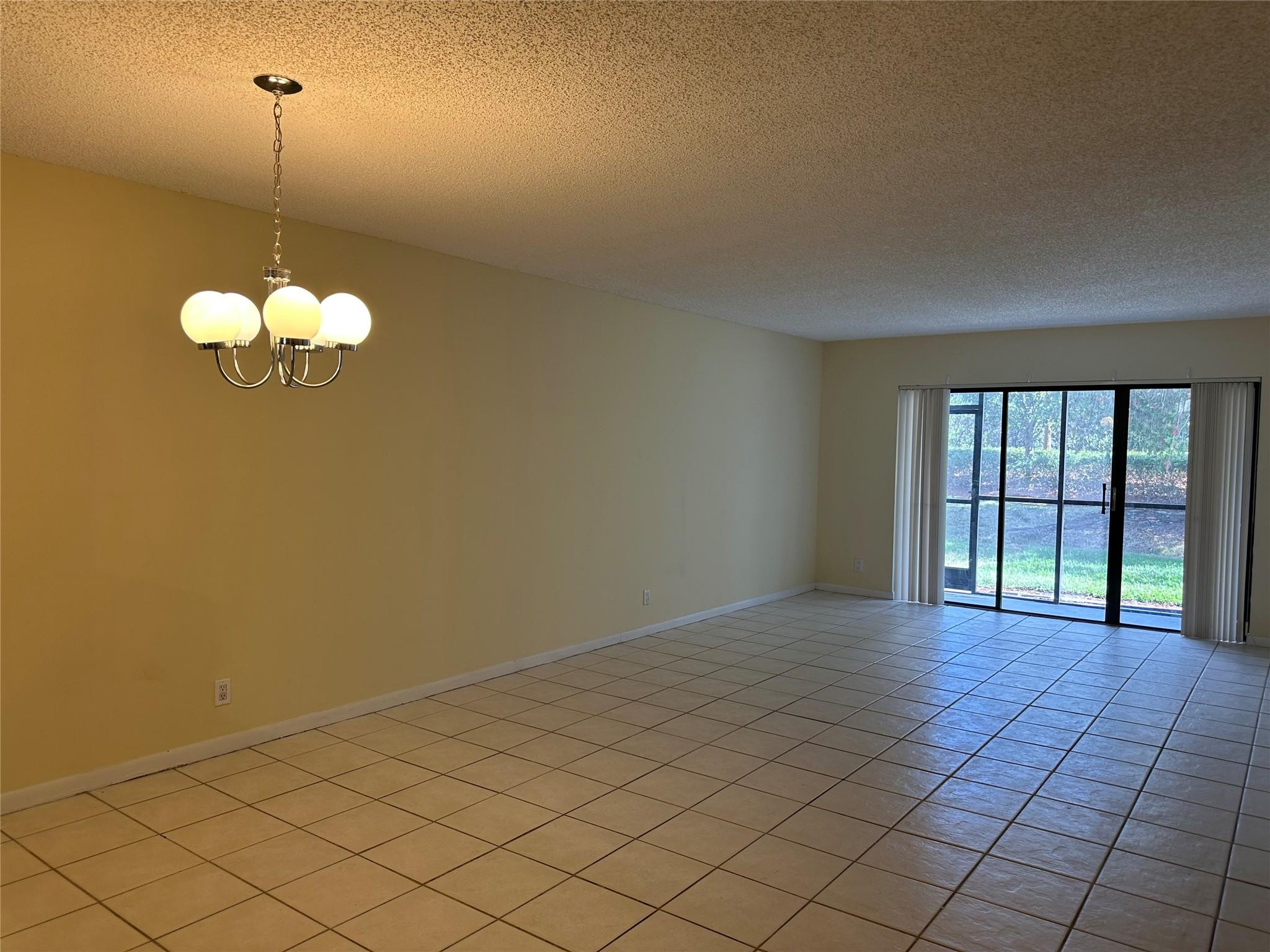 310 Racquet Club Road, Unit 103 Weston, FL 33326 - Photo 2 of 13 DINING & LIVING ROOM