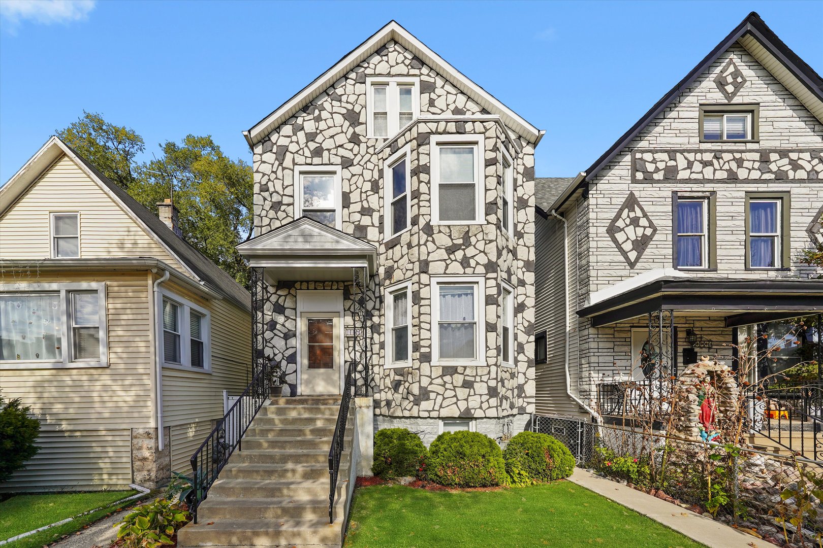 a view of a brick building with large windows