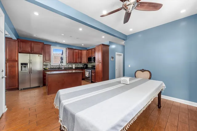 a kitchen with stainless steel appliances a refrigerator sink and cabinets