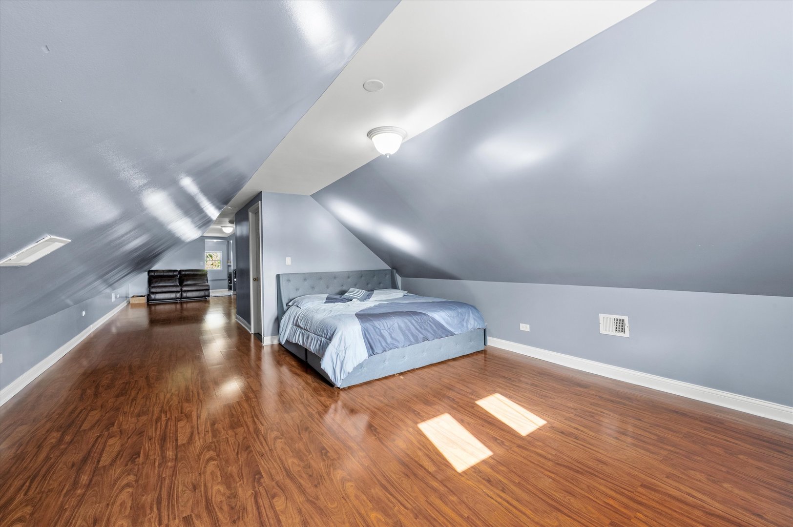 5108 West 24th Place, Unit 2 Cicero, IL 60804 - Photo 21 of 29 a spacious bedroom with a bed and a wooden floor