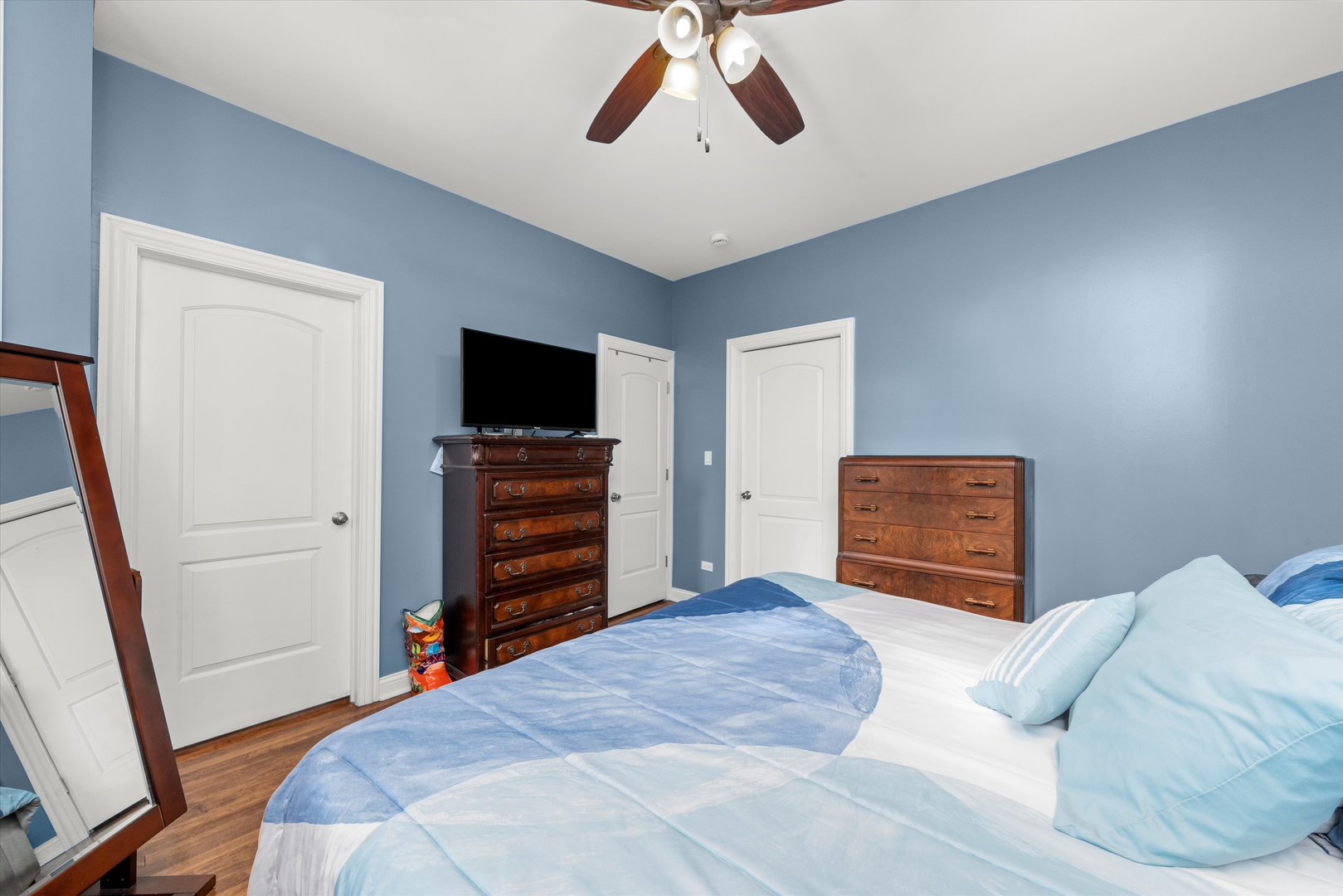 5108 West 24th Place, Unit 2 Cicero, IL 60804 - Photo 8 of 29 a bedroom with a bed and a television