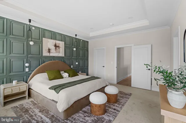 a bedroom with a bed and a potted plant