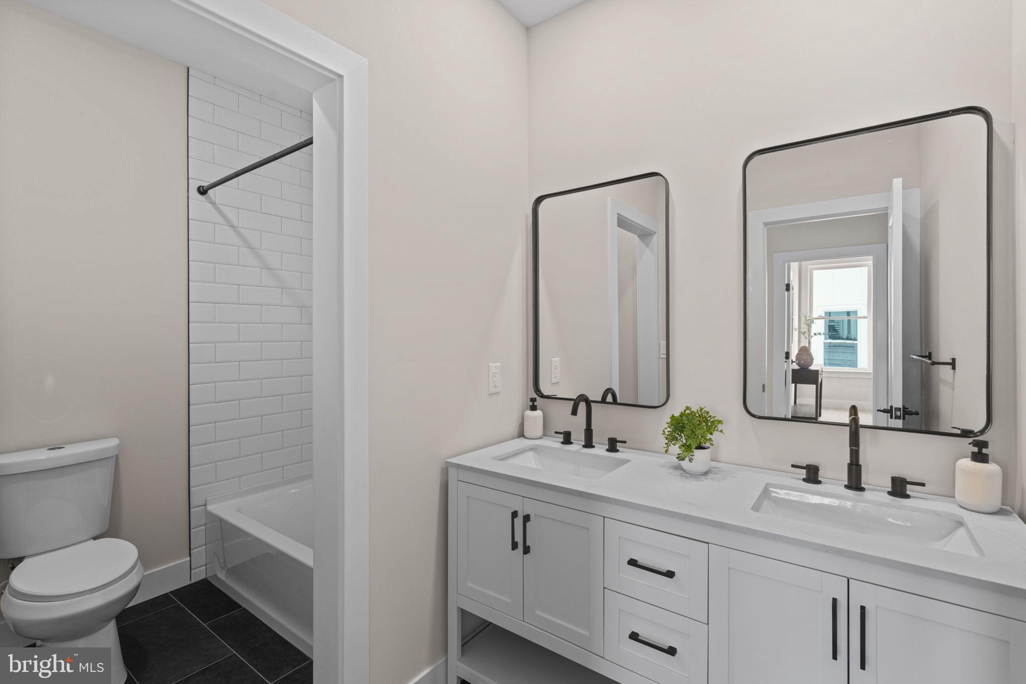 649 Provident Road Southampton, PA 18966 - Photo 24 of 36 a bathroom with a double vanity sink mirror and toilet