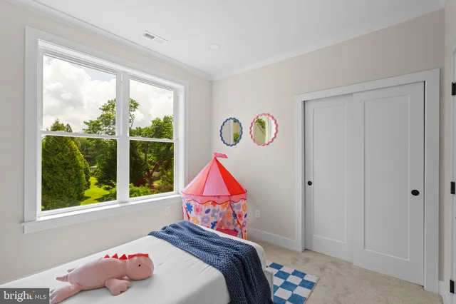 a room that has a bed and a window