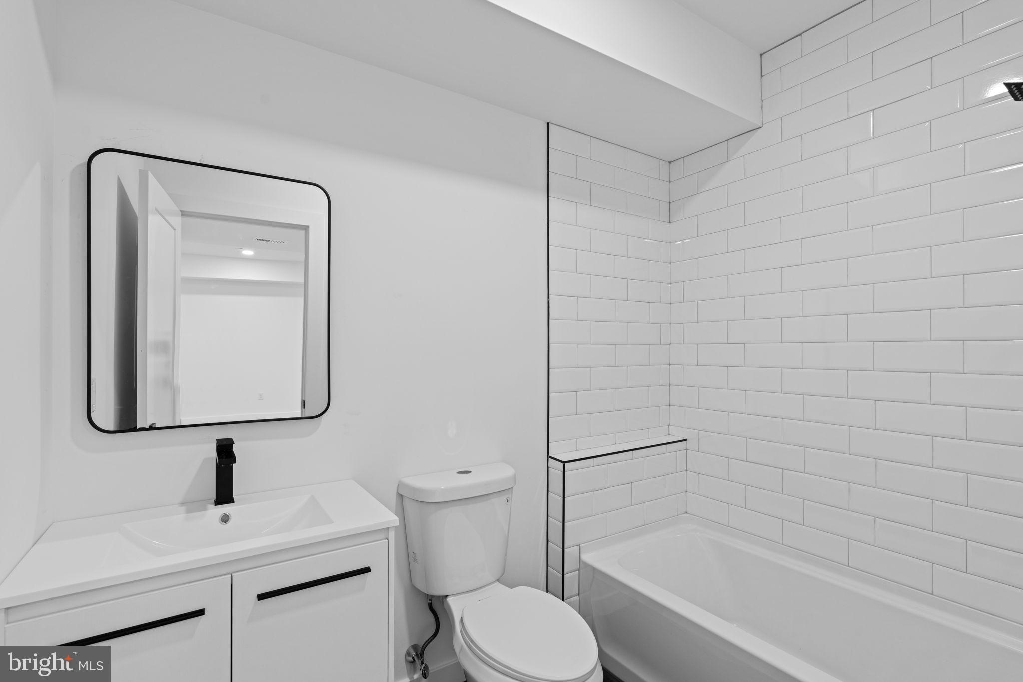 649 Provident Road Southampton, PA 18966 - Photo 33 of 36 a bathroom with a toilet sink vanity shower and mirror