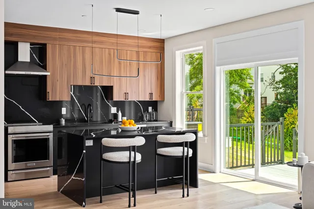 a kitchen with a appliances a stove a table and chairs