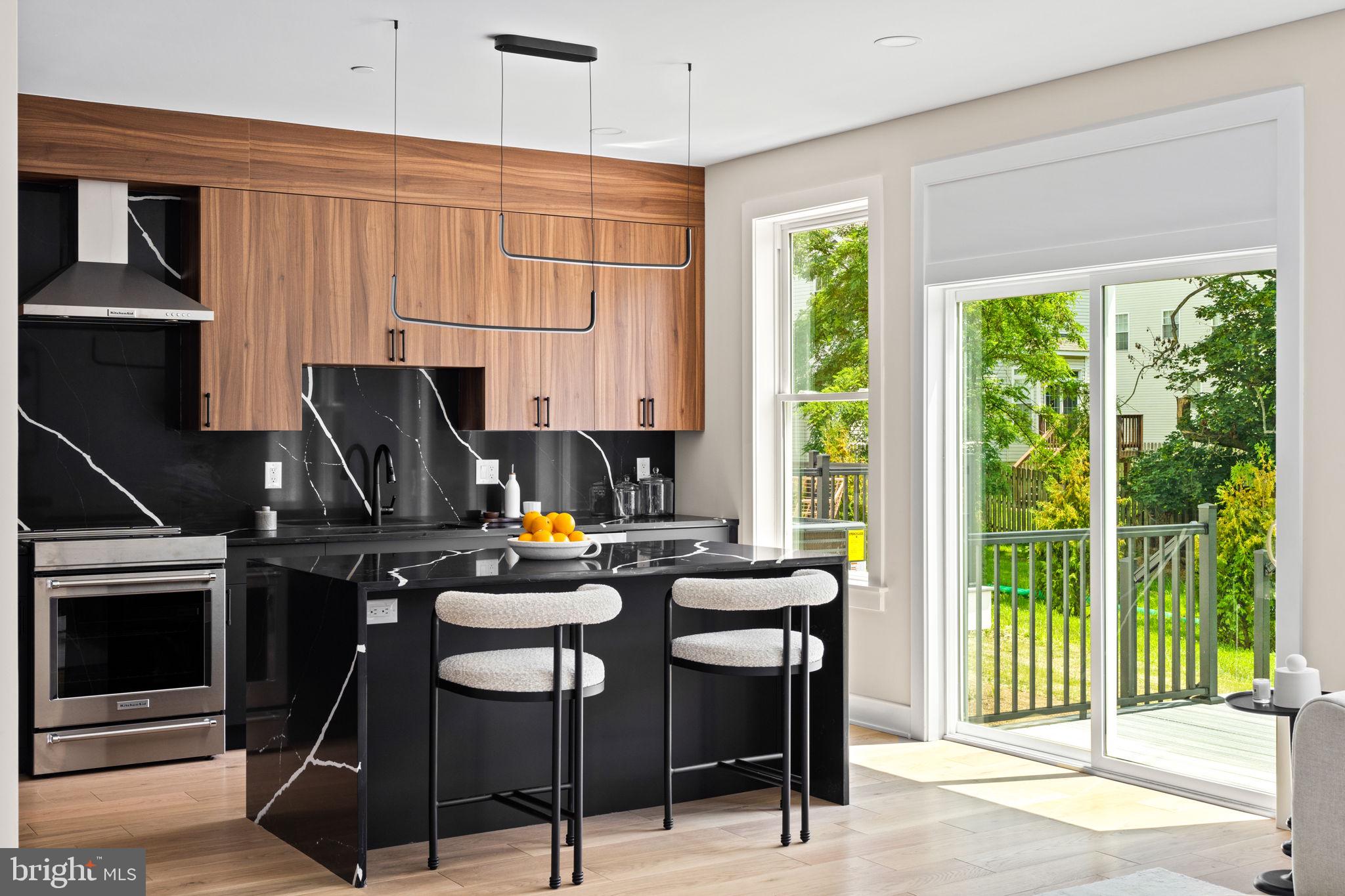 649 Provident Road Southampton, PA 18966 - Photo 8 of 36 a kitchen with a appliances a stove a table and chairs