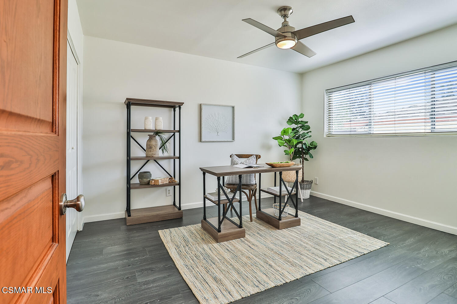 844 16th Street, Unit 5 Santa Monica, CA 90403 - Photo 16 of 31 wooden floor with a table and a potted plant