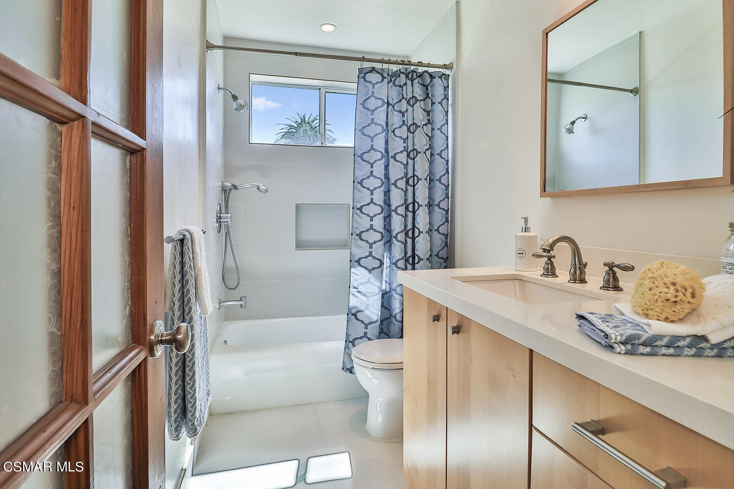 844 16th Street, Unit 5 Santa Monica, CA 90403 - Photo 18 of 31 a bathroom with a granite countertop sink toilet and shower