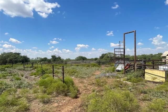 a view of swimming pool with outdoor seating and lake