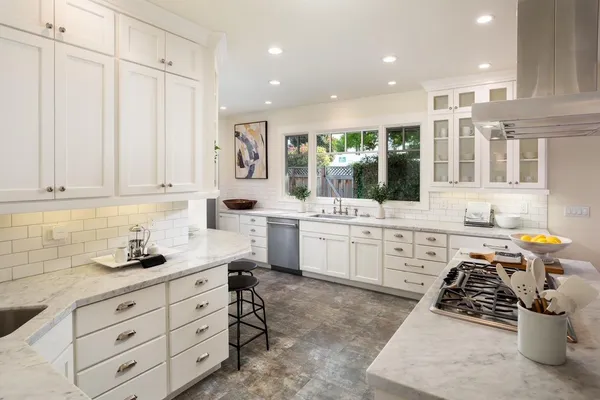 a kitchen with sink cabinets and window