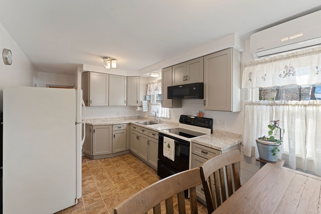 8 Taft Street Uxbridge, MA 01569 - Photo 8 of 31 a kitchen with stove cabinets and refrigerator