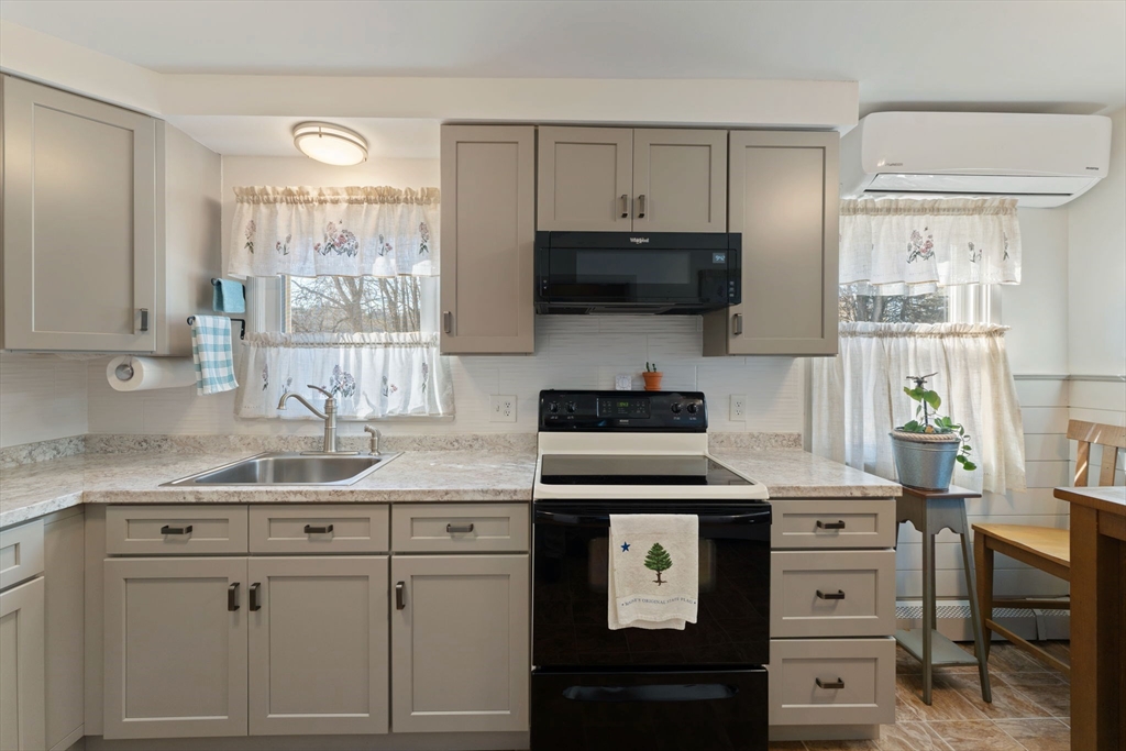 8 Taft Street Uxbridge, MA 01569 - Photo 10 of 31 a kitchen with white cabinets and appliances
