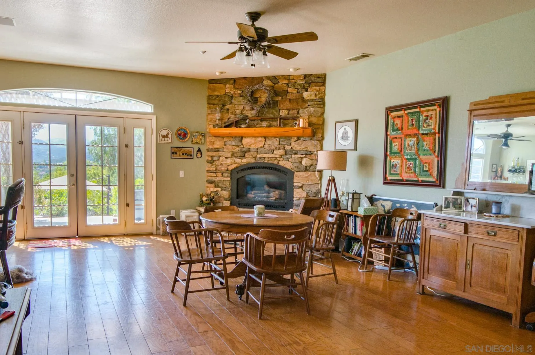 24517 Rutherford Road Ramona, CA 92065 - Photo 12 of 50 a view of a dining room with furniture window and wooden floor