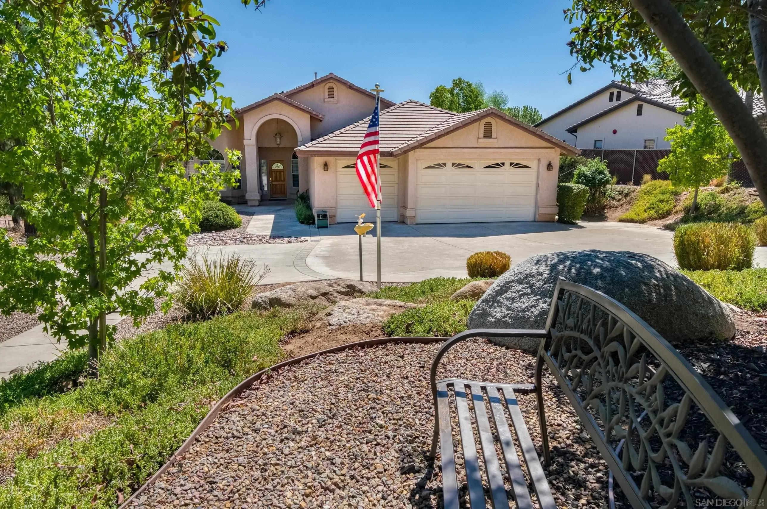 24517 Rutherford Road Ramona, CA 92065 - Photo 2 of 50 a front view of a house with garden