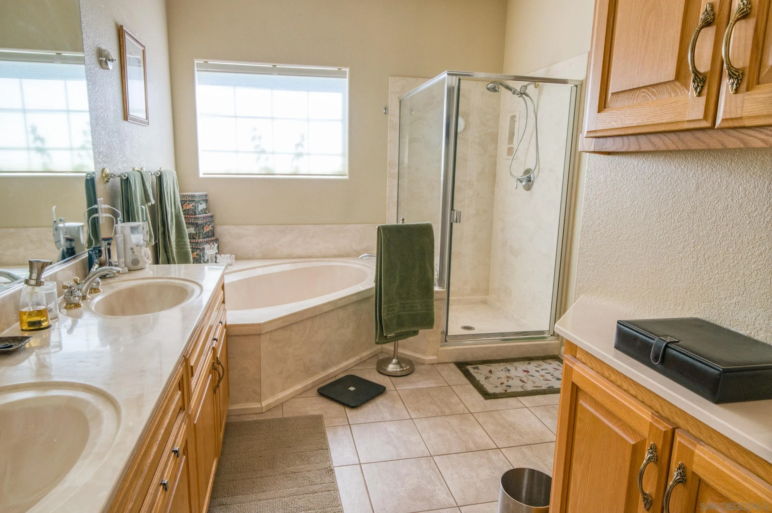 24517 Rutherford Road Ramona, CA 92065 - Photo 30 of 50 a bathroom with a tub sink and mirror