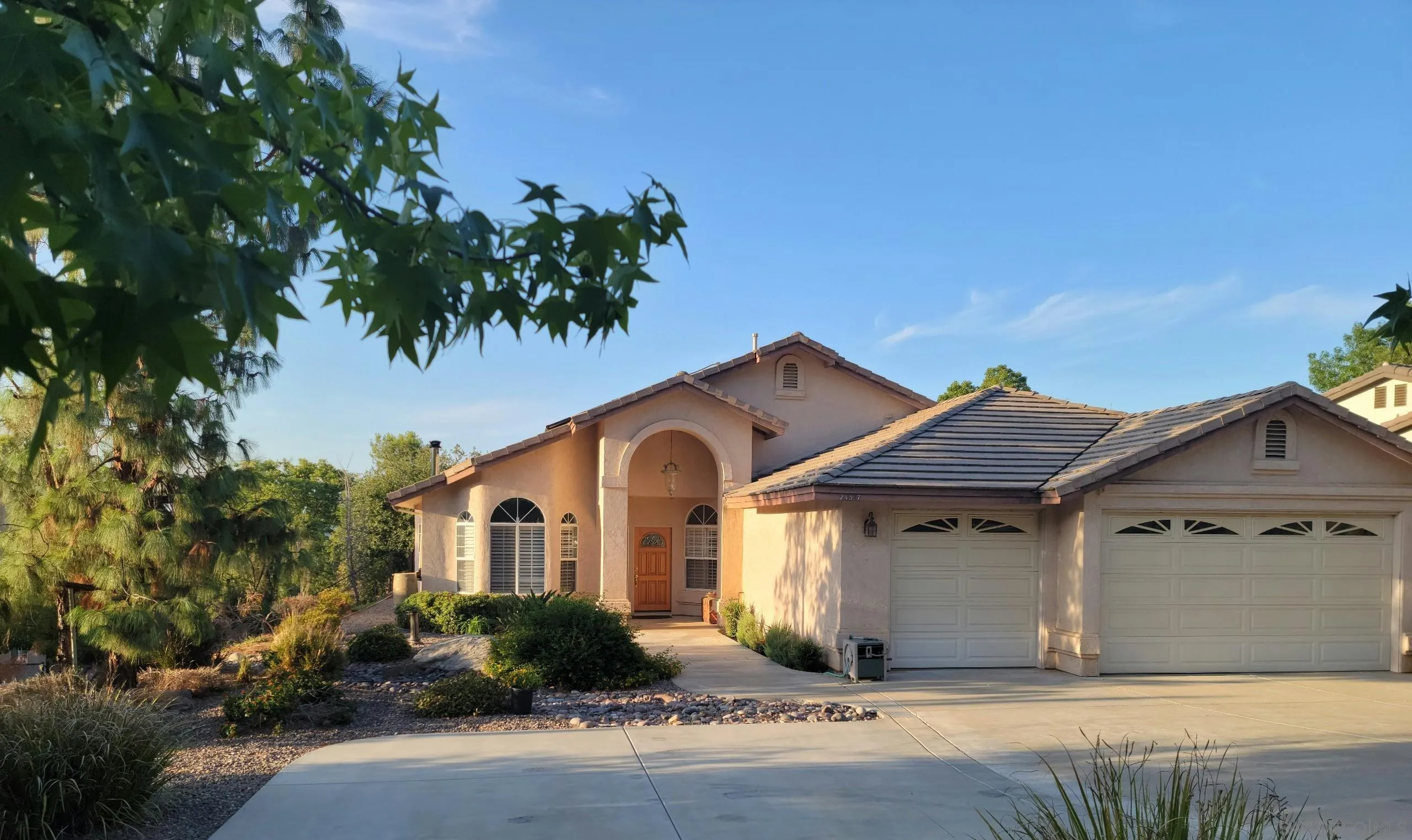 24517 Rutherford Road Ramona, CA 92065 - Photo 4 of 50 a front view of a house with garden
