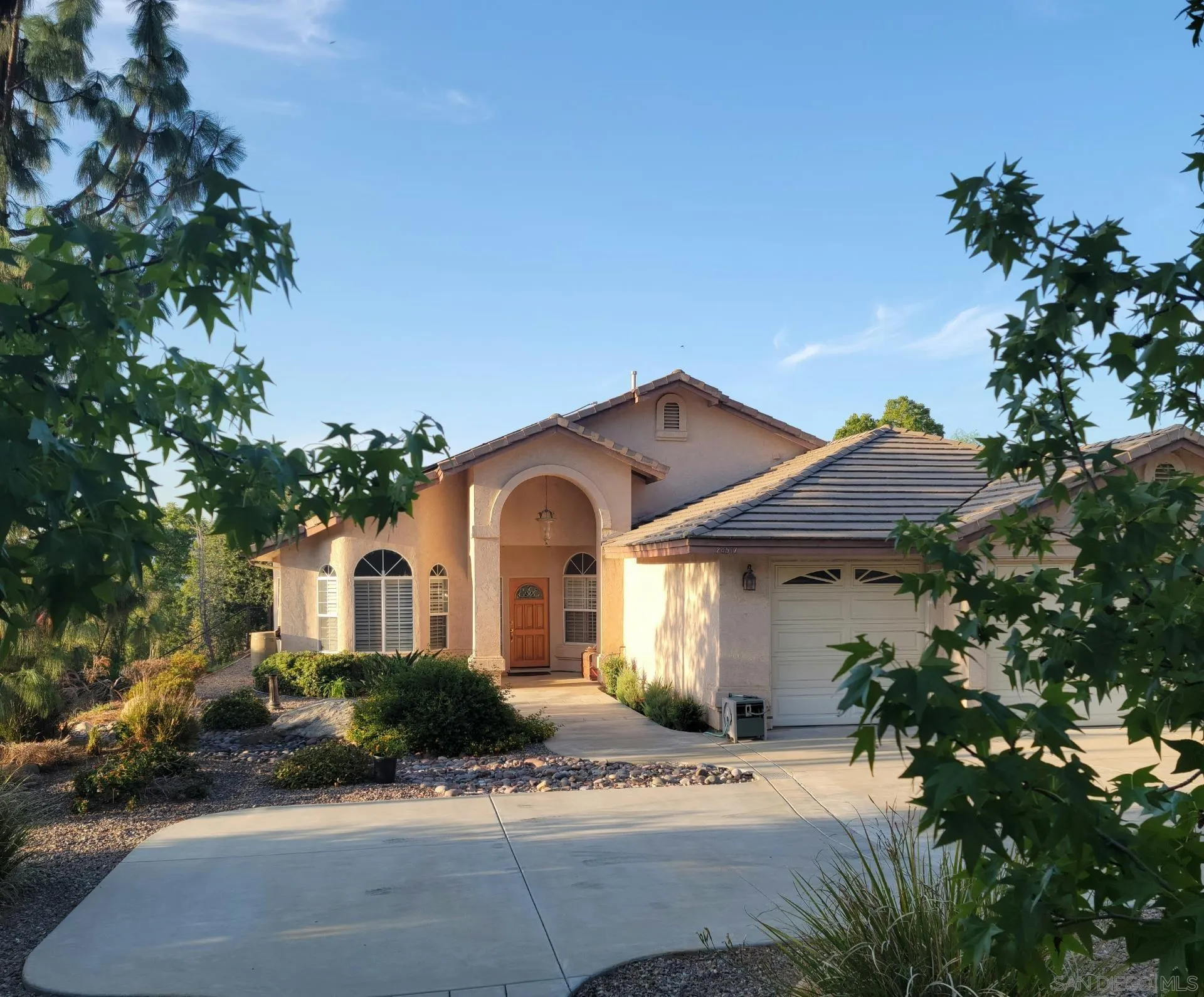 24517 Rutherford Road Ramona, CA 92065 - Photo 5 of 50 a front view of a house with a yard
