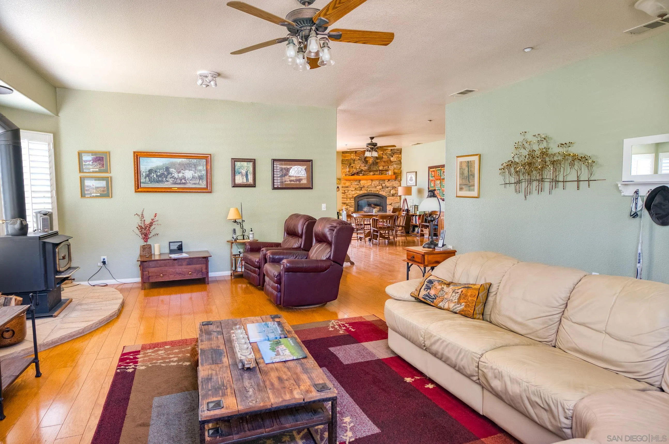 24517 Rutherford Road Ramona, CA 92065 - Photo 10 of 50 a living room with furniture fireplace and a window