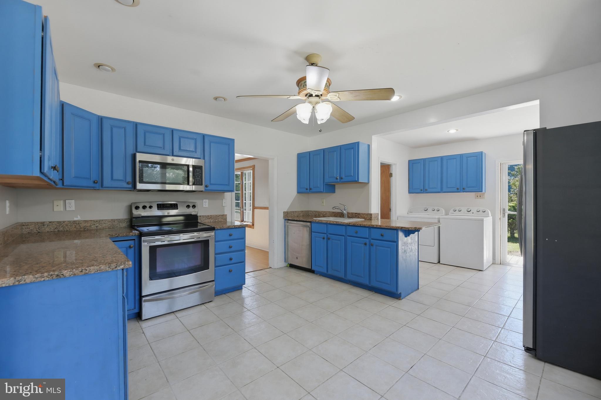 448 North Chew Road Hammonton, NJ 08037 - Photo 9 of 45 Bright kitchen with bold blue cabinets.
