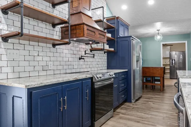 a view of living room with granite countertop furniture and fireplace