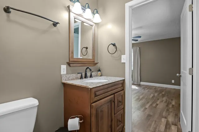 a view of room with window and ceiling fan