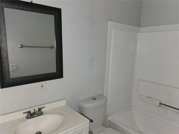 a bathroom with a sink toilet and vanity