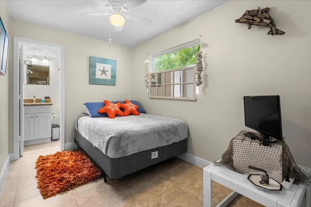 a bedroom with a bed and balcony