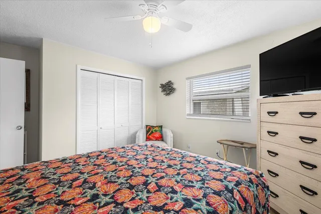 a view of a house with swimming pool and porch with furniture