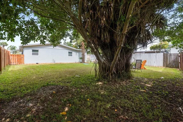an aerial view of a city with lots of residential buildings in ocean