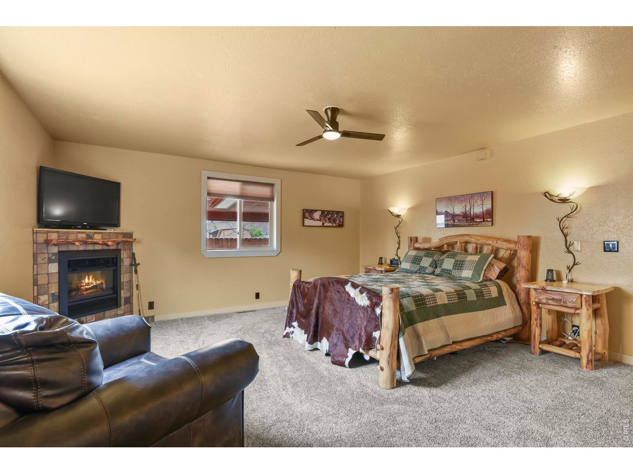 417 2nd Street Fort Lupton, CO 80621 - Photo 11 of 24 a bed room with a bed and a couch